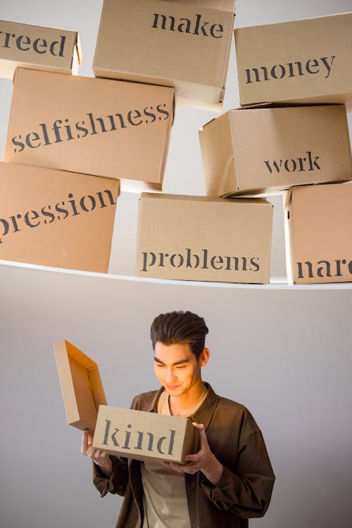 A Man Looking at the Box · Free Stock Photo