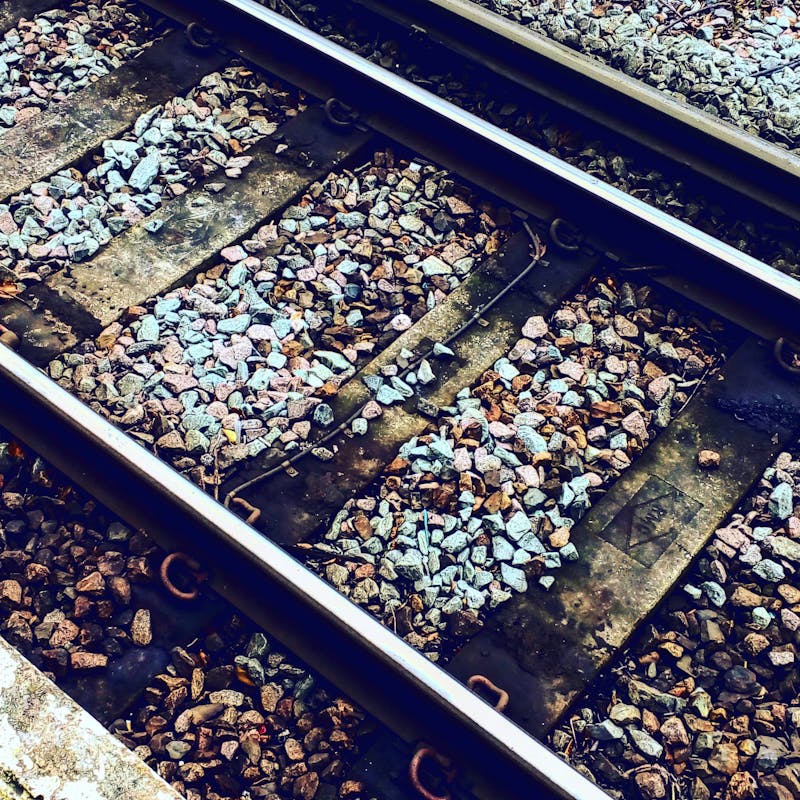 Whispers Along the Train Tracks at the Edge of Town