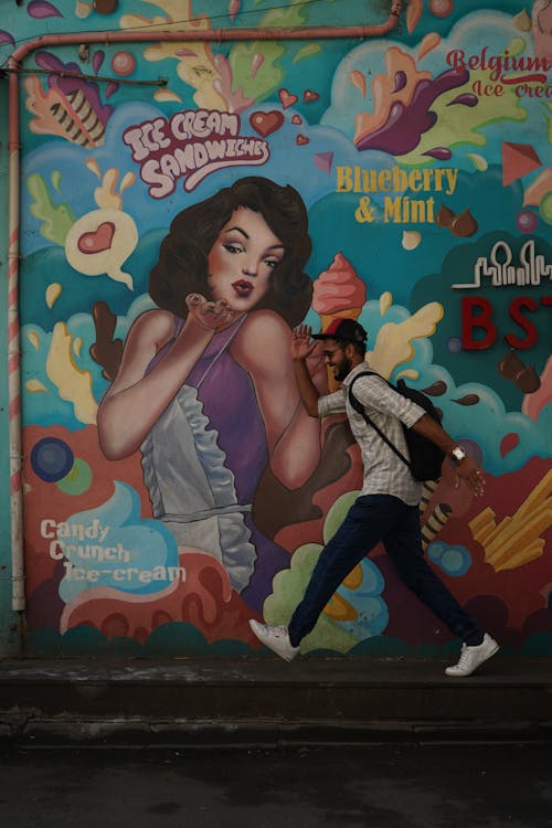 Man Running Near Painted Wall 