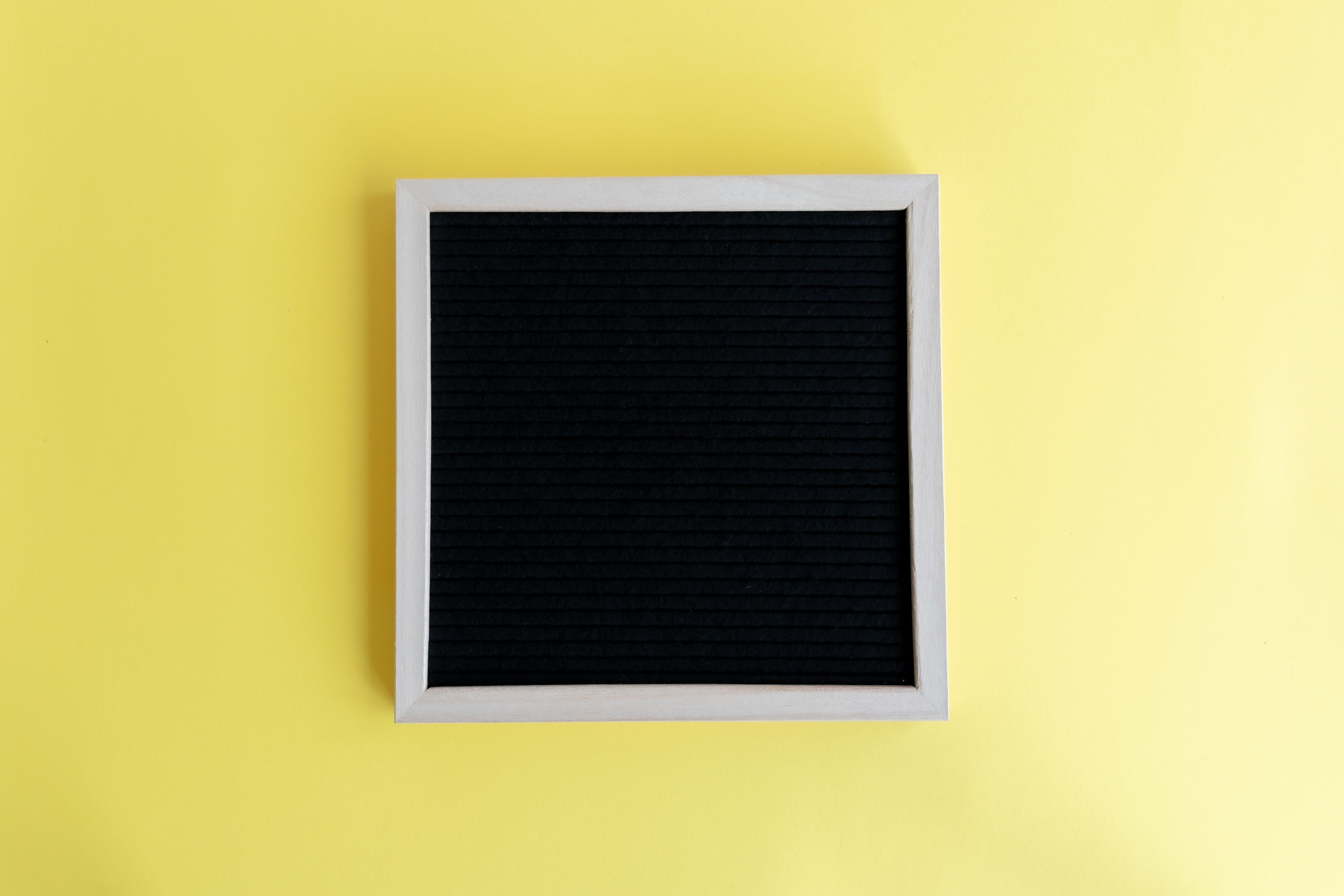 Blank Frame on Studio Yellow Background · Free Stock Photo