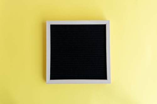Blank Frame on Studio Yellow Background