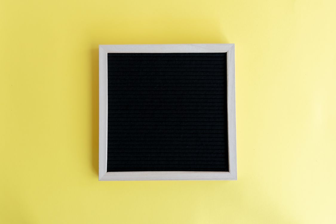 Blank Frame on Studio Yellow Background · Free Stock Photo
