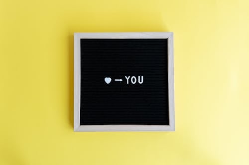 Text in a Letter Board on Yellow Background