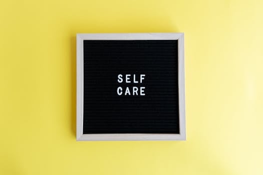 Inspiring self care message on a blackboard with a vibrant yellow background.