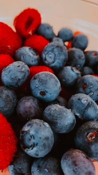 Close-up of blueberries and raspberries showcasing freshness and vibrant colors.