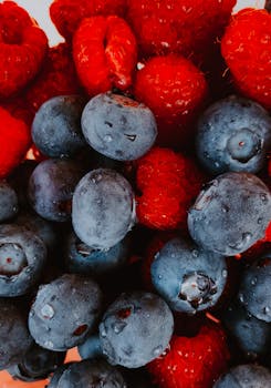 Vibrant fresh blueberries and raspberries creating a healthy and delicious snack photo.
