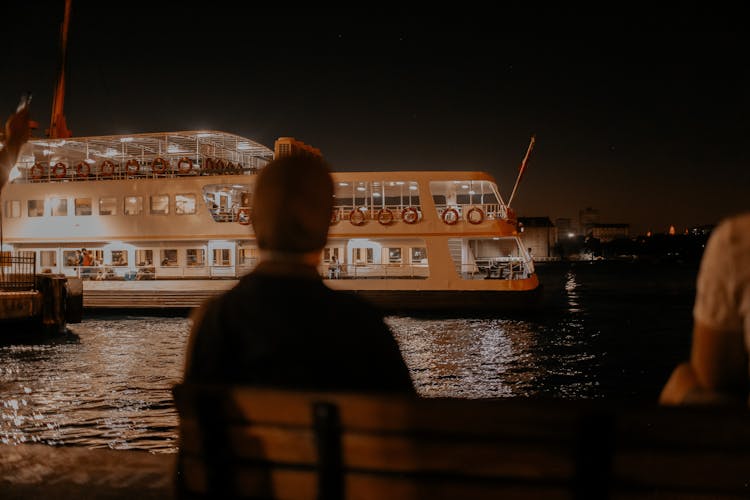 A Ferry Boat In The Sea At Night