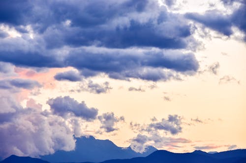 Mountain Range under Thick Clouds