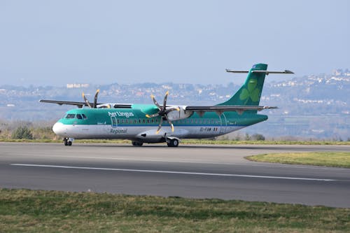 Green Passenger Plane on Runway