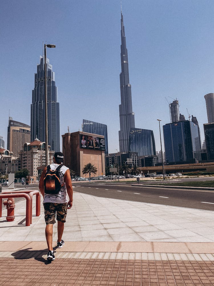 Back View Of A Man Walking In The City