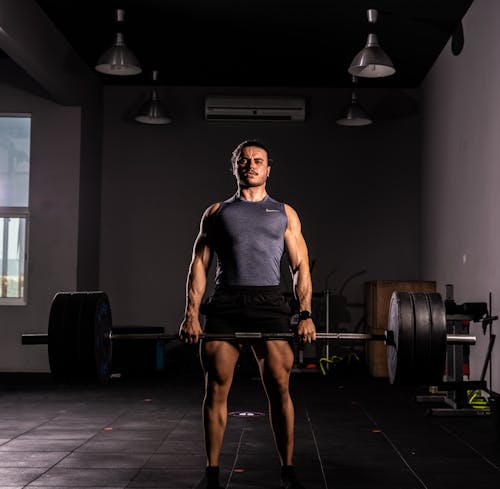 Free Man Lifting a Barbell Stock Photo