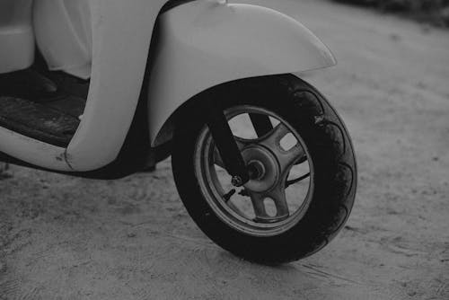 Free Grayscale Photo of Motorcycle on Dirt Ground Stock Photo