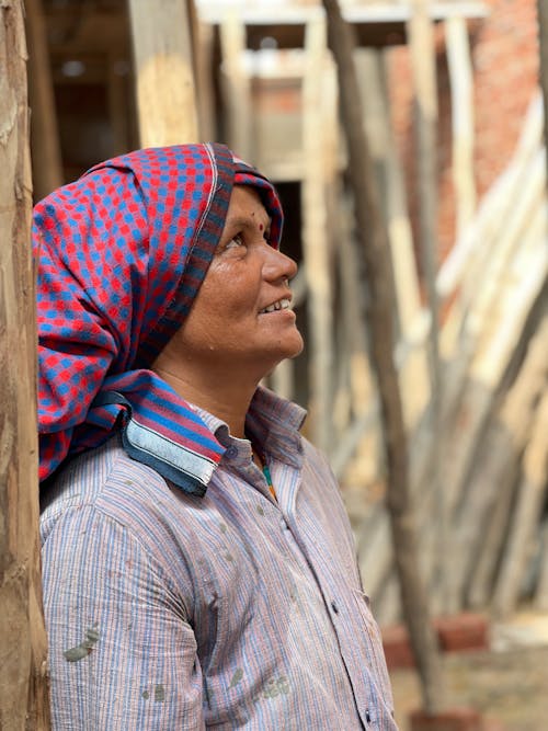 A Man in Striped Shirt and Headscarf