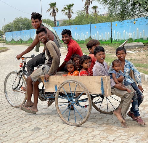 Kids Riding a Bicycle Cart