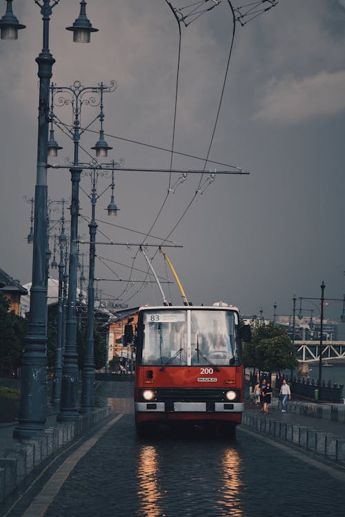 Red Tram Passing on a Street