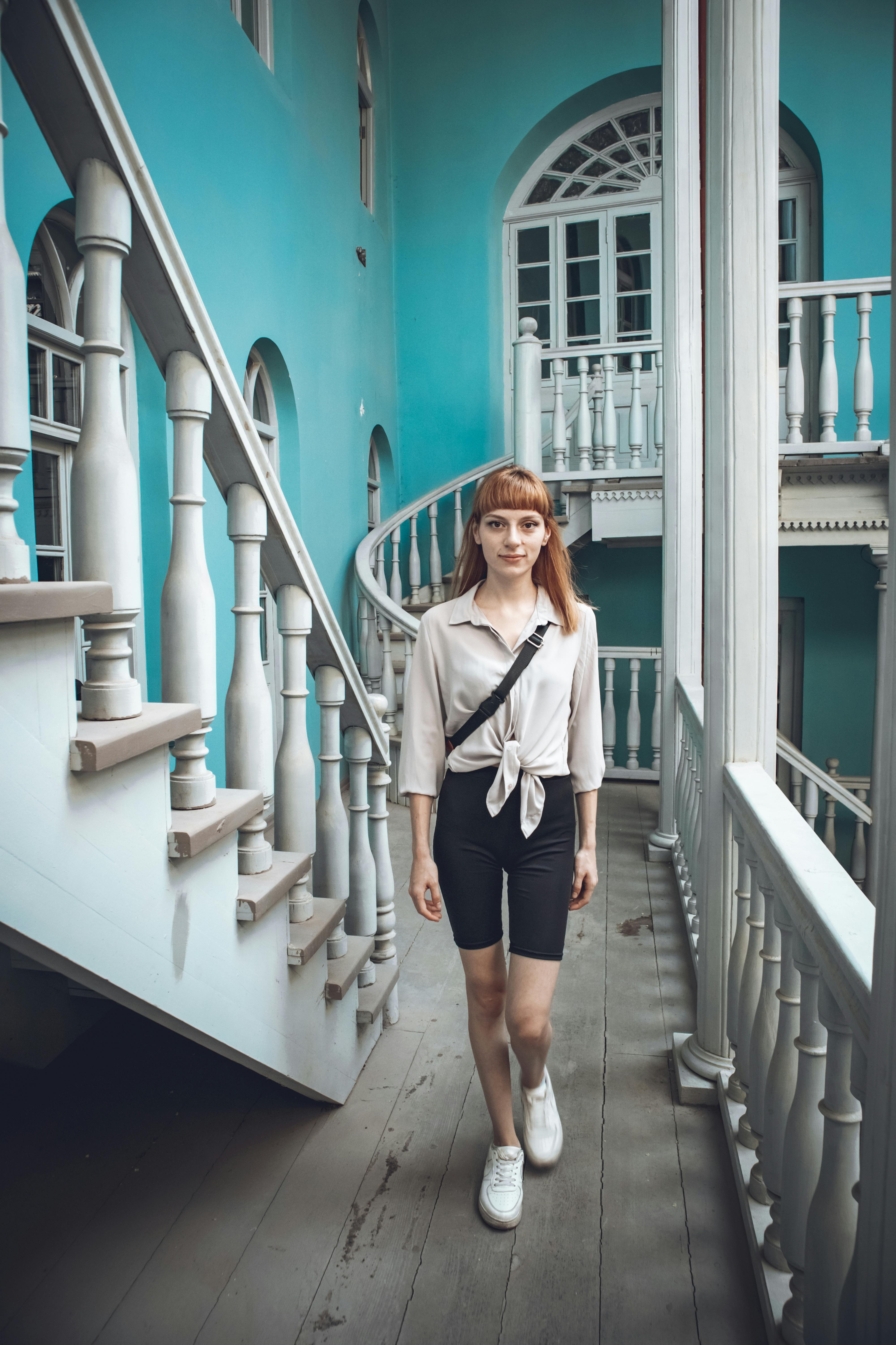 A Woman Wearing Long Sleeves While Walking · Free Stock Photo