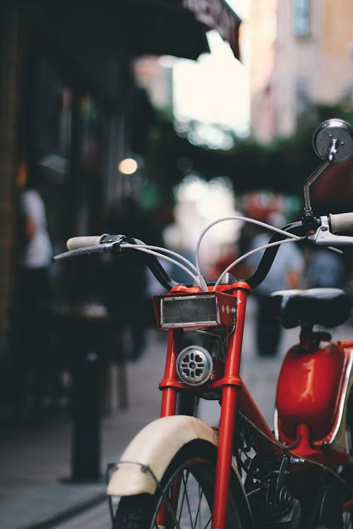 Close up of Red Vintage Motorbike on a Street