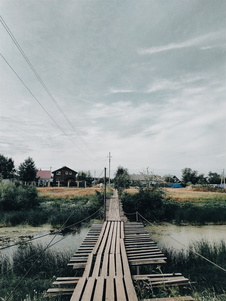 Wooden Suspension Bridge In Countryside