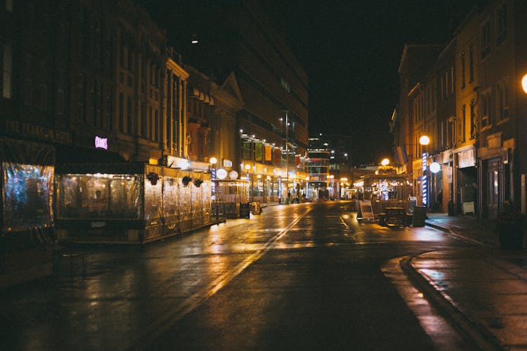 Illuminated Empty City Street At Night