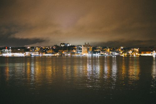 Free Night view of Istanbul's illuminated skyline reflecting on water, showcasing urban beauty. Stock Photo