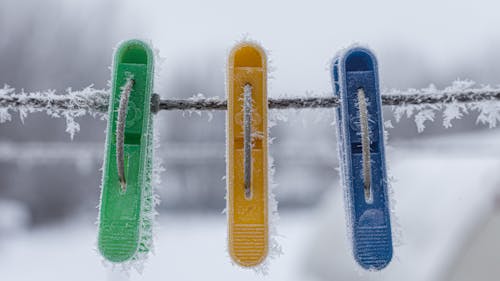 Free Clothes Pin and Rope Covered with Snow Flakes Stock Photo
