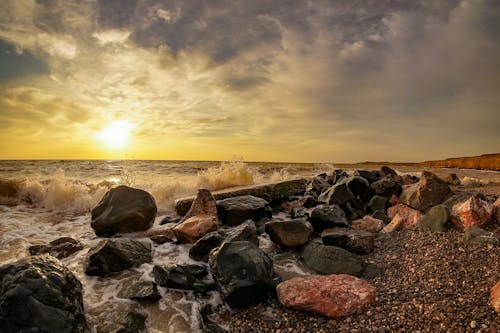 A View of the Beautiful Sunset from the Rocky Shore