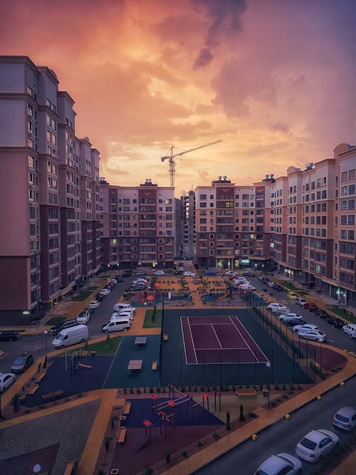 Modern Residential Blocks Complex in City at Sunset 