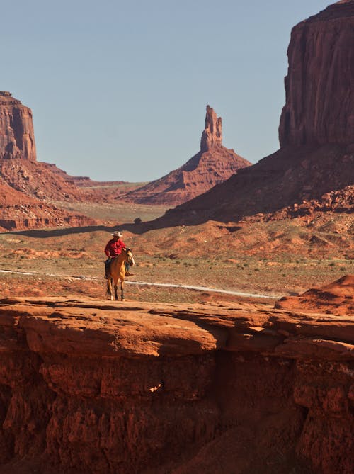 Man on Horseback in Monument Valley, Navajo, United States 