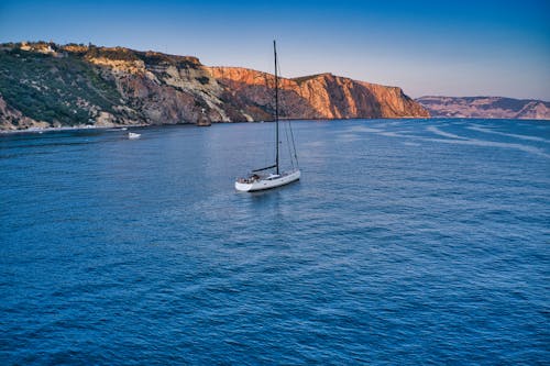 White Sailboat on Floating on the Sea