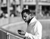 Man in White Dress Shirt Using Smartphone
