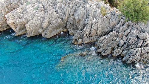 Free Stunning aerial view of a rugged coastline in Turkey with clear blue waters. Stock Photo