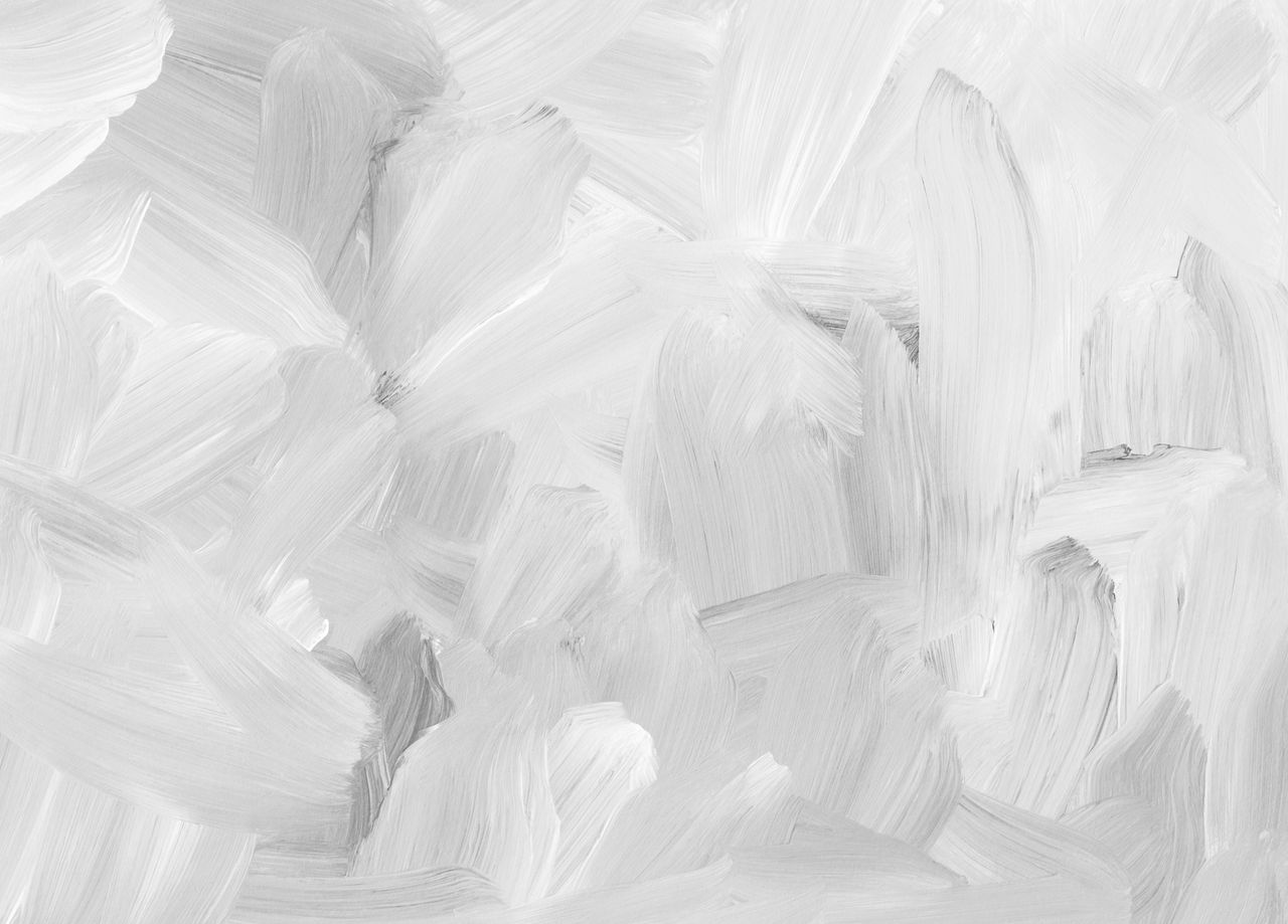 a close up of abstract white brushstrokes creating a textured artistic