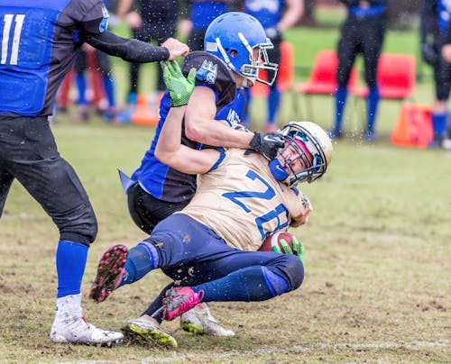 Men Playing the Game of Football