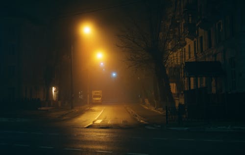 Dark Road with Street Lamps During Night Time · Free Stock Photo