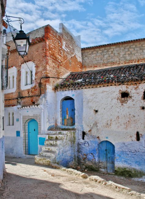 Explore the iconic blue-washed buildings and rustic charm of Chefchaouen's vibrant streets.