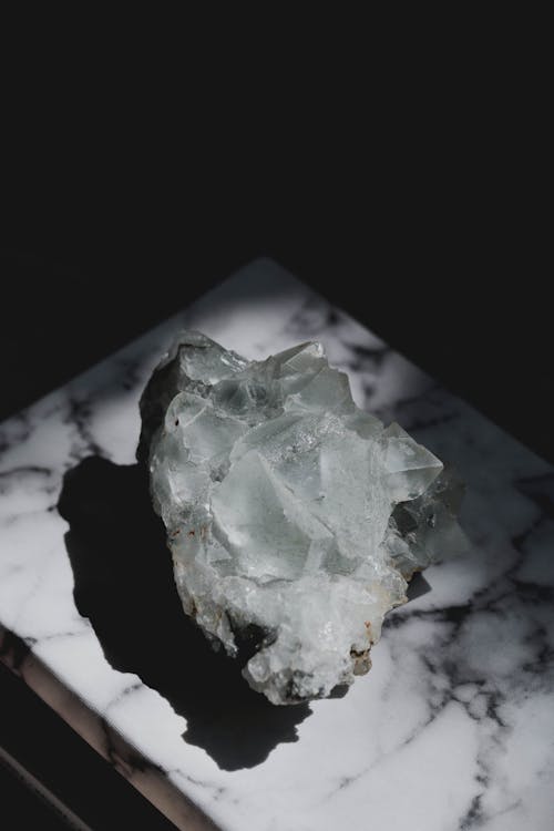 Free Apophyllite Crystals on a White Surface Stock Photo