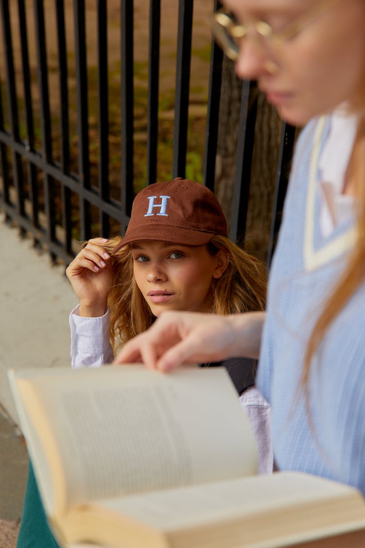 Photo Of A Woman Wearing Brown Baseball Cap