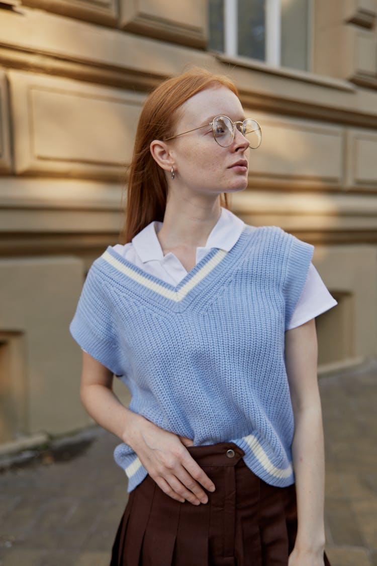 A Woman Wearing A Blue Knitted Vest