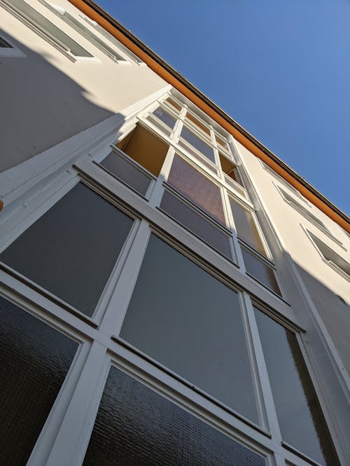 A Low Angle Shot of Windows on the Building