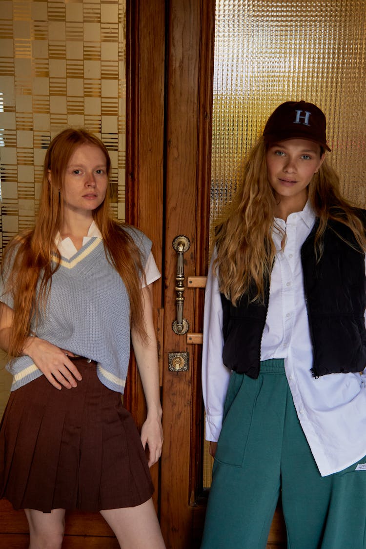 Women Standing Beside The Wooden Door