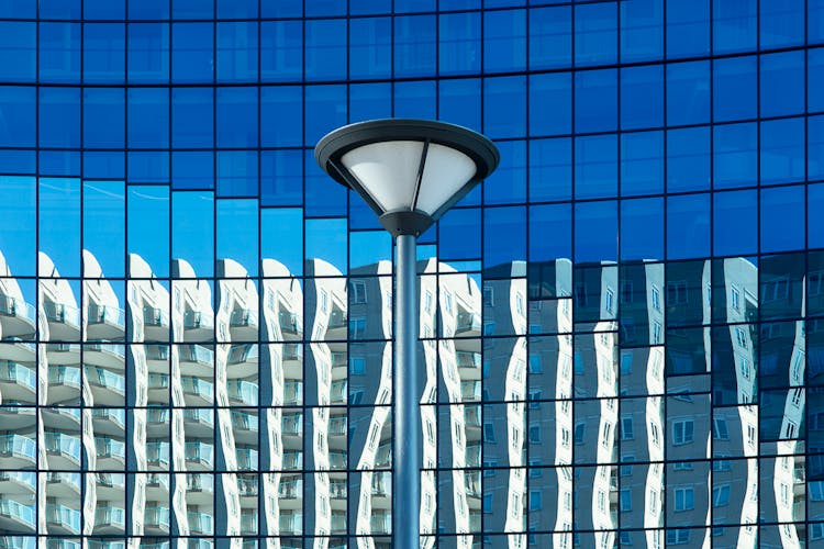 Street Light On Glass Futuristic Building Background