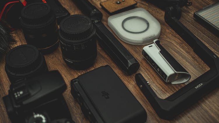 Professional Photographic Equipment On Wooden Table