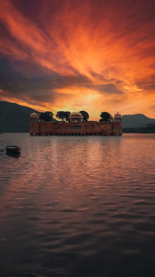Free Water Palace on Body of Water under Sunset Sky Stock Photo