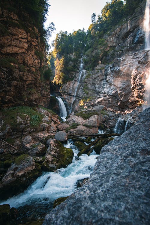  Brown Mossy Rocks with Cascading Waterfalls 