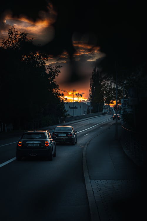 Free Moving Cars on the Road During Sunset Stock Photo