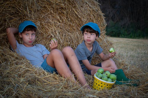 Boys Sitting on Hay