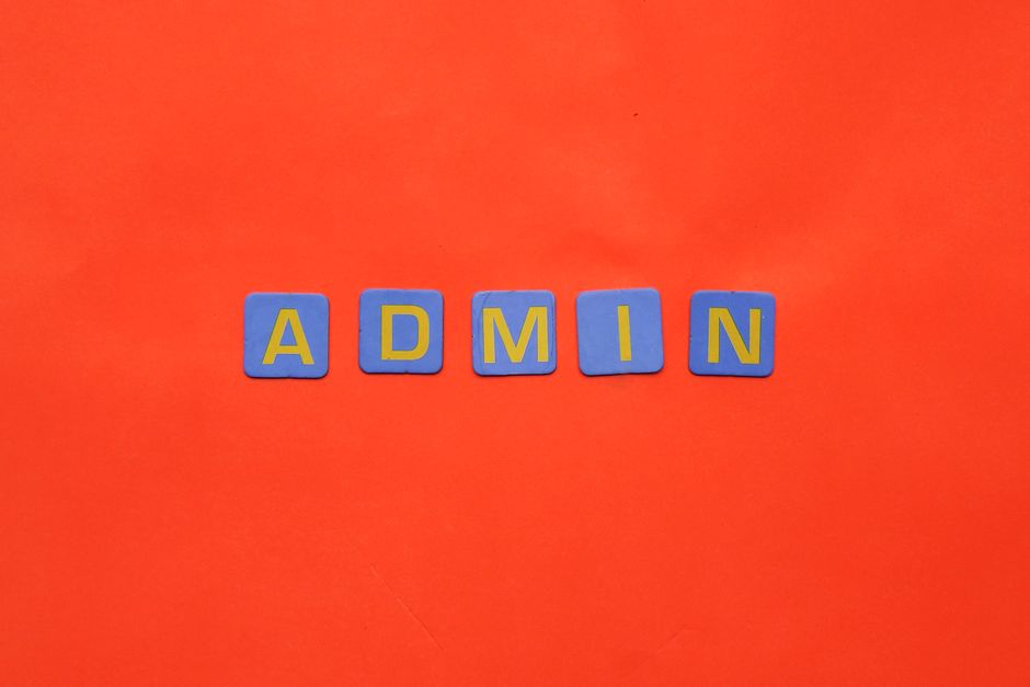 Vibrant display of 'ADMIN' text on a bright red surface.