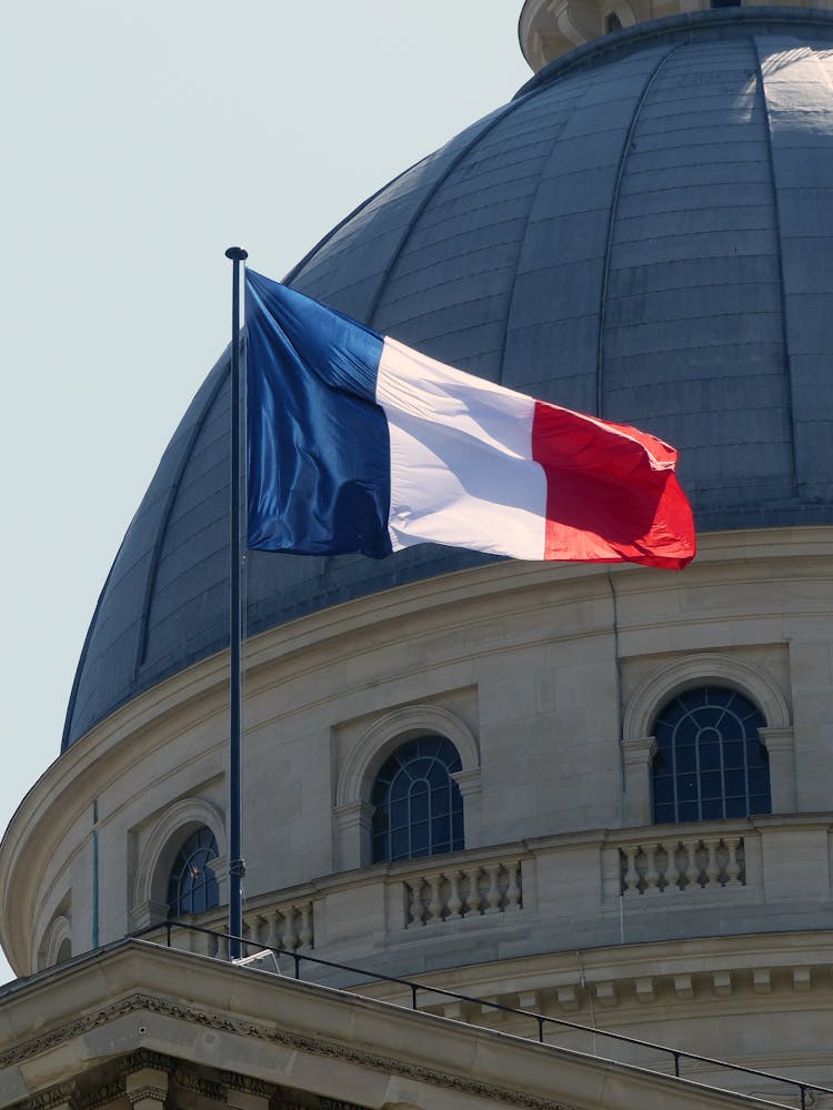 The Flag Of France On A Flagpole