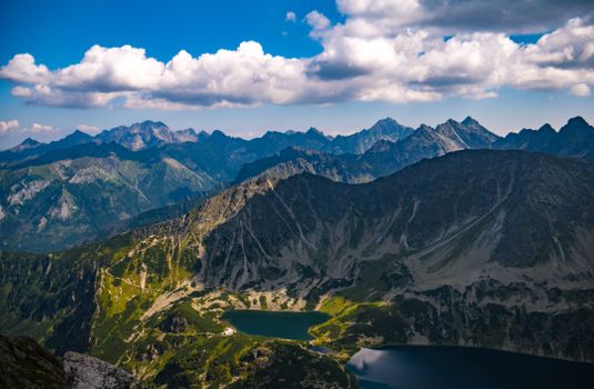 A stunning aerial view of the Tatra Mountains with lakes and clouds in Zakopane, Poland.