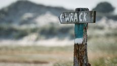 Wooden Signage on a Pole